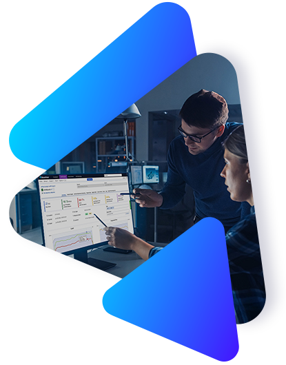 Two individuals looking at a monitor with Perforce BlazeMeter testing software dashboards
