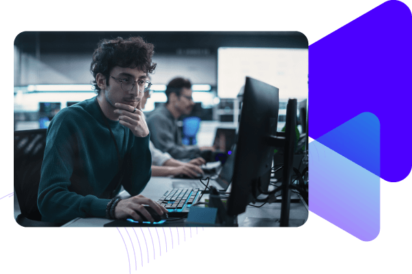 Developer viewing desktop in office.